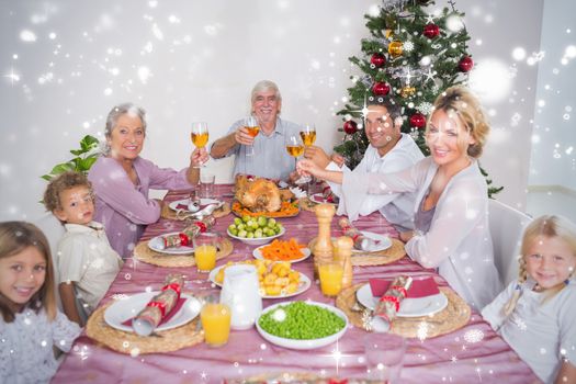 Composite image of Family raising their glasses at christmas against snow falling