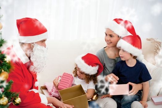 Santa giving presents to his children in the living room against snowflakes