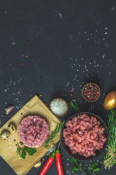 Healthy food, cooking concept. Homemade raw organic minced beef meat and Raw Ground beef Burger steak patties cutlet with vegetables. Copy space background, top view flat lay.