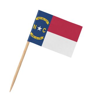 Small paper US-state flag on wooden stick - North Carolina - Isolated on white