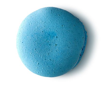 One blue macaroon top view on white background
