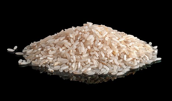 Pile white rice with reflection on black background