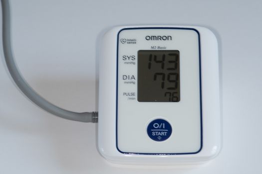 Blood pressure monitor isolated on white UK