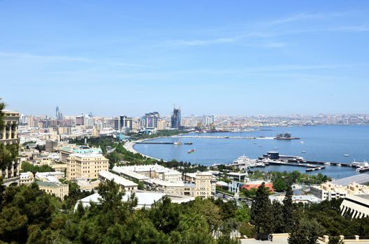 Baku.Azerbaijan.Panorama.View on the coastal bay of the capital on the Caspian Sea.This is the Baku Boulevard, it is visited by locals and tourists, and along it runs the route of the race stage, held every year, Formula 1