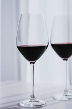 Two crystal glasses of red wine, organic beverage product