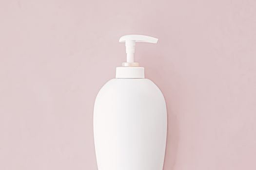 Bottle of antibacterial liquid soap and hand sanitizer on beige background, hygiene product and health care concept