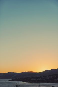 Beautiful sea view and mountains in the Mediterranean at sunset, summer vacation travel and holiday destination