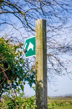 Bright green Public Footpath sign to a Bridal Way In Lancashire
