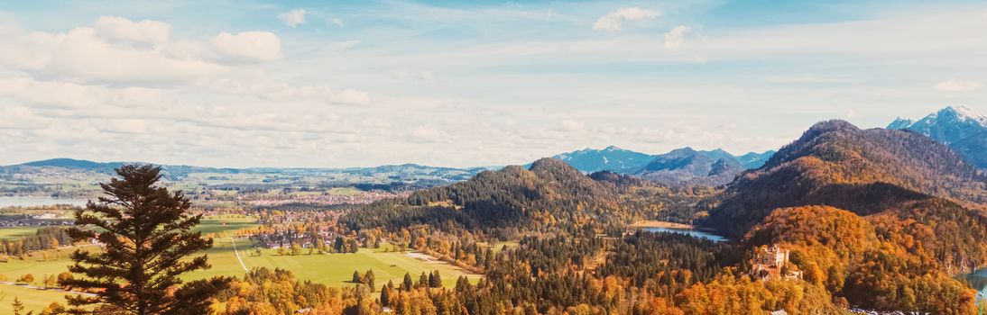 Beautiful nature of European Alps, landscape view of alpine mountains, lake and village in autumn season, travel and destination scenery