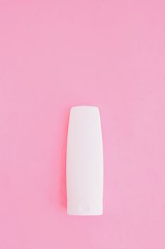 Moisturizing hand cream or body lotion on pink background, beauty product and skin care cosmetics, flatlay