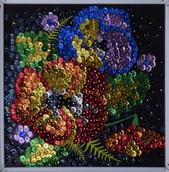 Sequined embroidered bouquet of flowers on canvas.