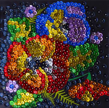 Sequined embroidered bouquet of flowers on canvas.