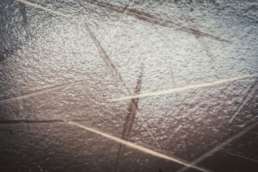 A close up of door or window glass embossed with patterns