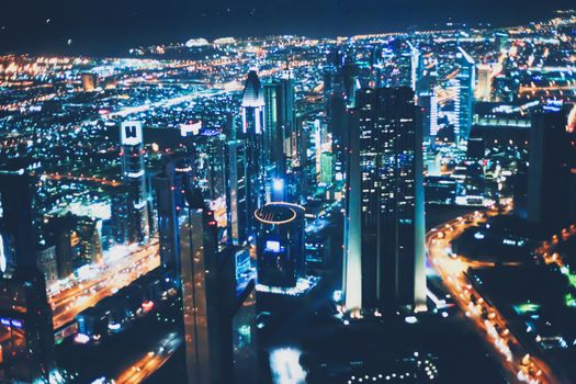 Aerial night view of Dubai in United Arab Emirates, metropolitan cityscape scenery