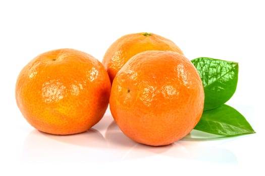 Fresh tangerines with leaves isolated on white background