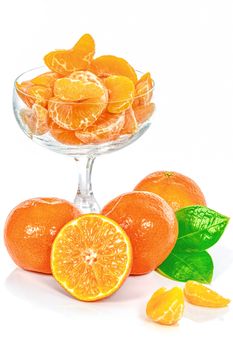 Fresh tangerines and glass of juice isolated on white background.