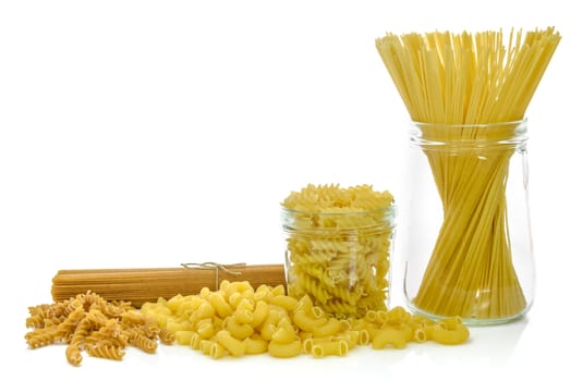 Mixed uncooked raw italian pasta isolated on white background