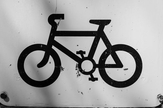 Bicycle symbol painted in black on white background UK