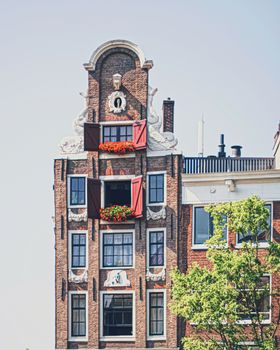 Main downtown street in the city center of Amsterdam in Netherlands on sunny day