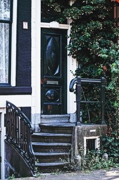 Architectural detail of a building on the main city center street of Amsterdam in Netherlands, european architecture