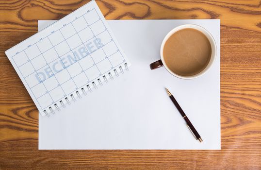 monthly planning schedule on wooden table