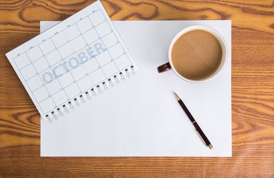 monthly planning schedule on wooden table
