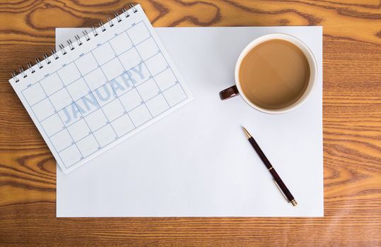 monthly planning schedule on wooden table