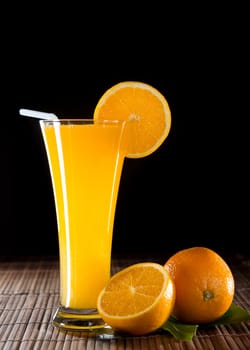 Orange juice on black background
