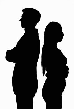 A silhouetted contoured black white portrait of a young couple standing with their backs to each other