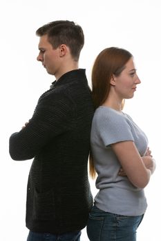 A man and a woman got into a quarrel and stood with their backs to each other
