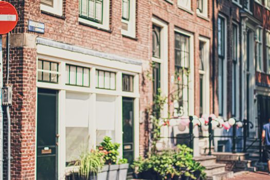 Main downtown street in the city center of Amsterdam in Netherlands on sunny day