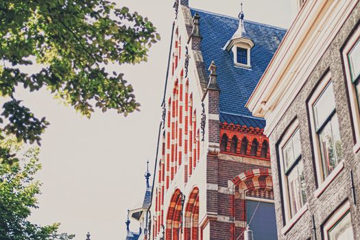 Main downtown street in the city center of Amsterdam in Netherlands on sunny day