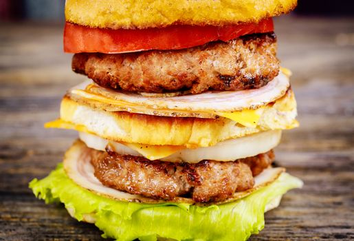 Beef burger, hamburger with grilled meat and vegetables