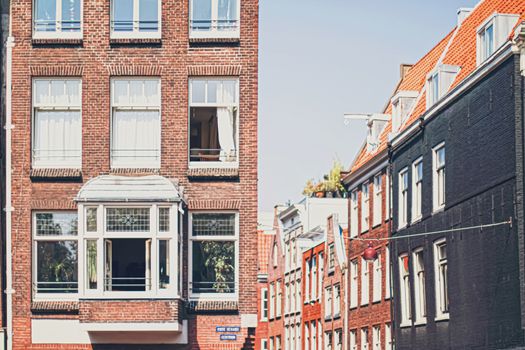 Main downtown street in the city center of Amsterdam in Netherlands on sunny day