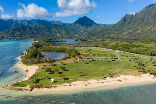 Aerial view of the beach and park at Kualoa with Ko'olau mountains in the background