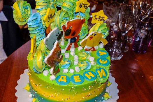 a Festive children's cake a happy birthday.
