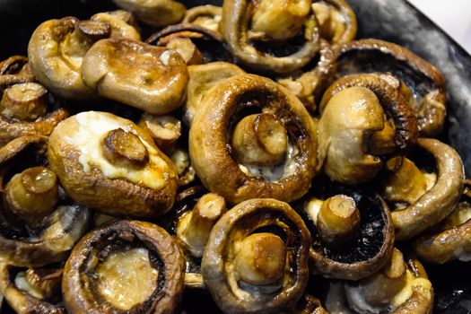 Baked mushrooms in a plate. fried mushrooms with mayonnaise.