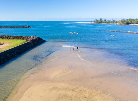 Aerial shot of traditional hawaiian canoes in the ocean off the North Shore town of Haleiwa