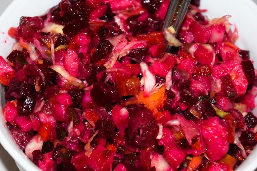 Beetroot vinaigrette in a plate on the table. Useful salad