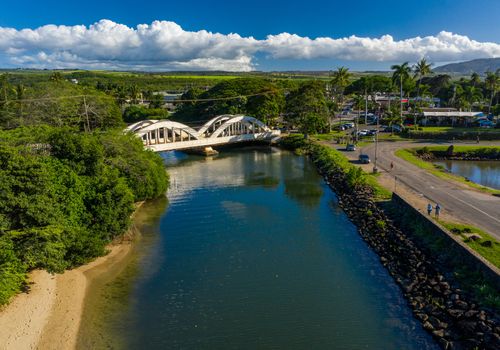 Aerial shot of the river anahulu and the twin arched road bridge in the North Shore town of Haleiwa