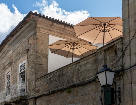 Umbrellas on rooftop restaurant in the old town of Guimaraes