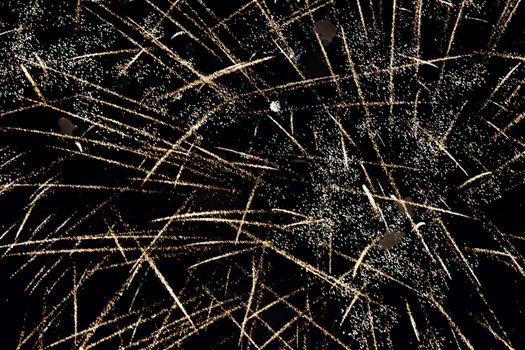 Festive salute in the night sky. Explosions of fireworks and pyrotechnics in the sky.
