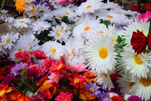 The flower shop counter. Lots of different colors.