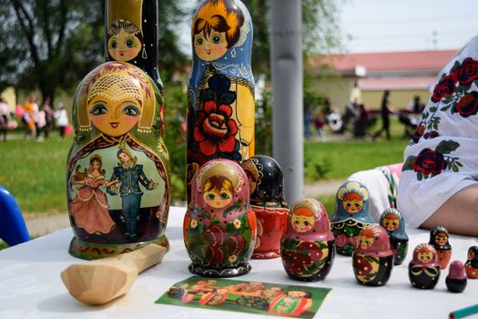 The matryoshkas are on the table. National Russian art painted matryoshkas.