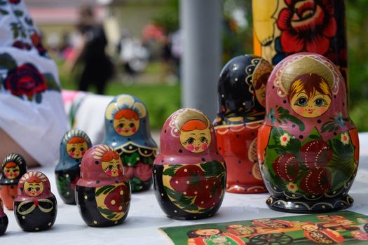 The matryoshkas are on the table. National Russian art painted matryoshkas.