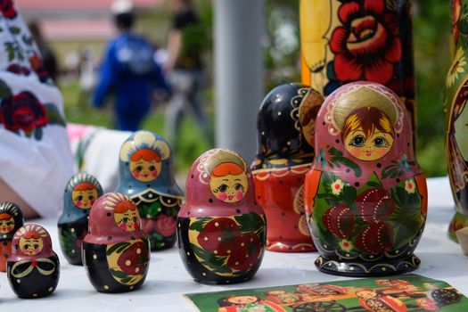 The matryoshkas are on the table. National Russian art painted matryoshkas.