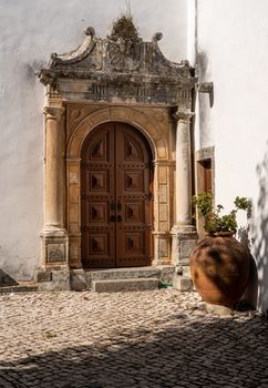 Side doorway into the Igreja de Santa Maria in the old medieval walled city of Obidos in Portugal