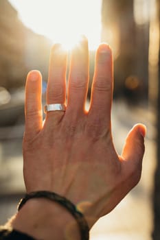 Beautiful hand with the ring and the sunlight