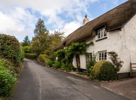 Stone home with thatched roof on small lane in the pretty Devon village of Dunsford