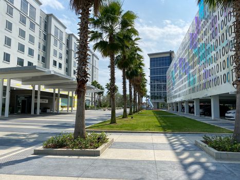 Orlando, FL/USA-4/10/20:  The exterior of the Binary Parking Garage and a Marriott Courtyard and Residence Inn at Town Center at Laureate Park at Lake Nona in Orlando, Florida.